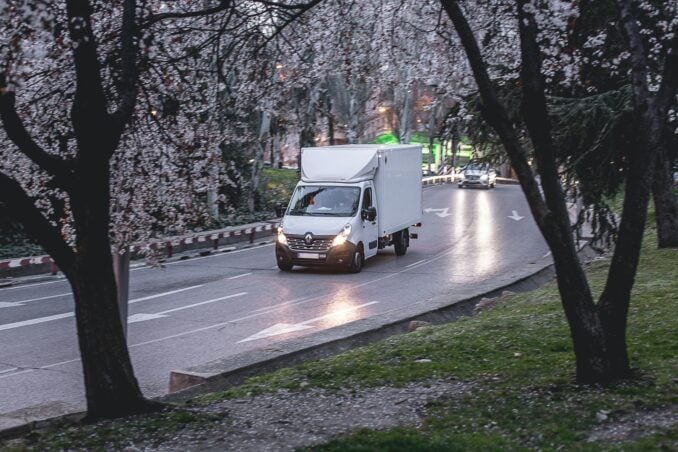 A van drives on a road.