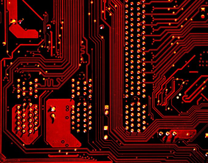 Close up of red circuit board.