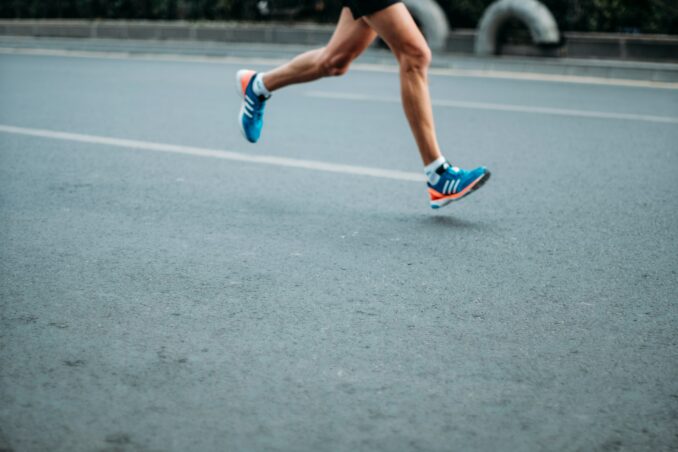 Marathon runner seen only from below knees