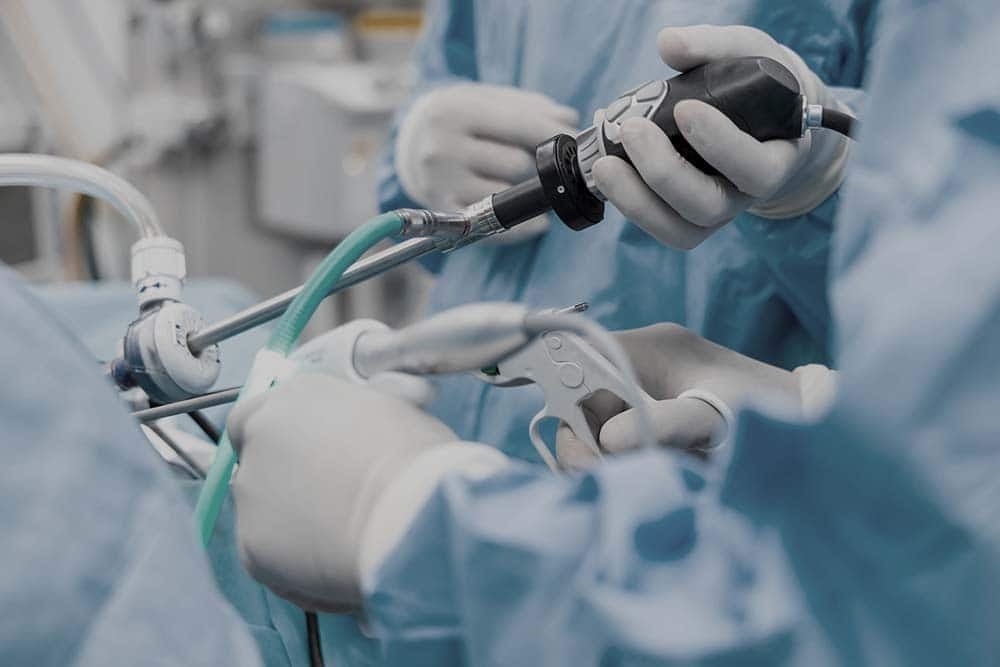 A team of doctor or surgeon did surgery inside operating room in